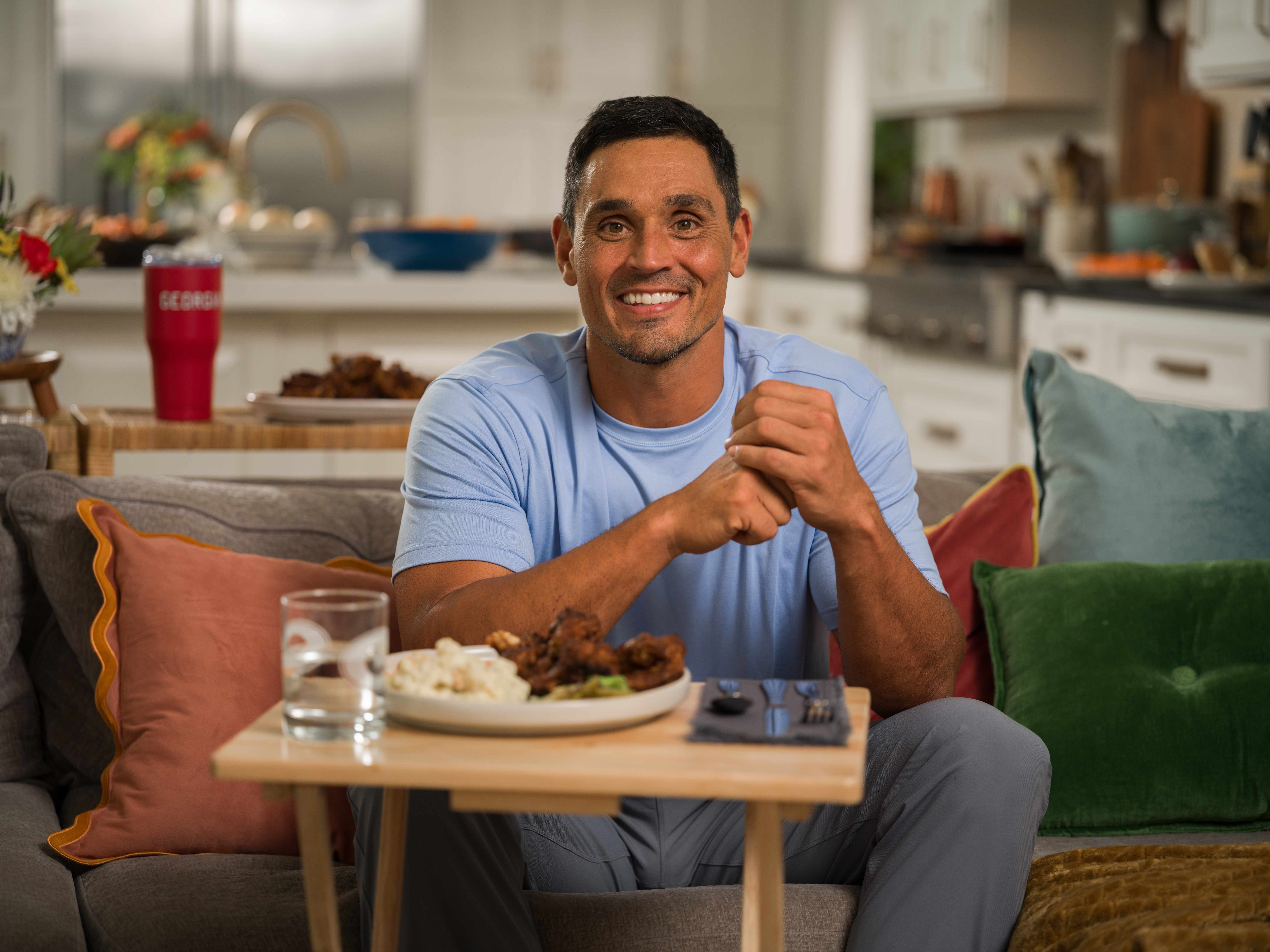David Pollack — Living room, on the couch with a plate of ribs.